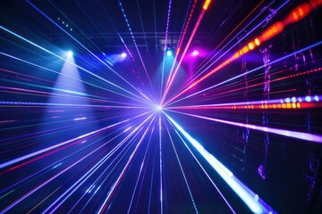Obraz premium Colorful laser light beams radiate outwards creating a mesmerizing visual effect in a concert setting
