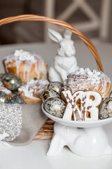 Fototapeta premium Banner for Orthodox Easter. Easter eggs with gold, Easter cakes and gingerbread in the shape of the letters XB in a woven basket made of vines.