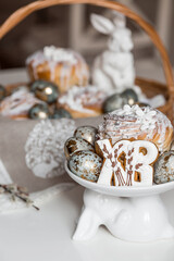 Banner for Orthodox Easter. Easter eggs with gold, Easter cakes and gingerbread in the shape of the letters XB in a woven basket made of vines.