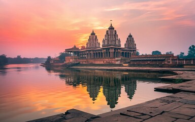 Fototapeta premium Sunrise reflecting on a serene temple by the water.
