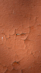 Aged orange wall texture with cracks and scratches