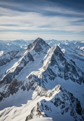 Obraz premium Aerial view of majestic snow-capped mountain peaks, rugged alpine landscape, vast mountain range, dramatic jagged ridges, pristine white snow, deep blue sky with wispy clouds, crisp winter sunlight, h