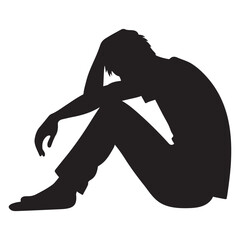 Silhouette of a Person Sitting in Despair