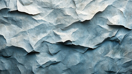 Fototapeta premium Textured blue paper with intricate folds creating a unique visual effect in an artistic display