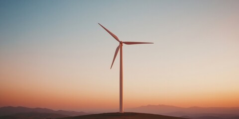 Obraz premium Wind Turbines Silhouetted Against a Golden Sunset in a Rural Landscape