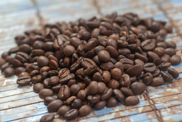 Coffee beans on the dark wooden background