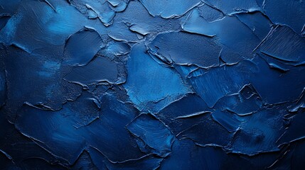 Rich textured blue wall featuring various shades and strokes of paint in layered design