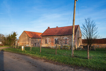 Burgundy landscape with farm, fields and trees in winter