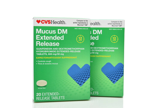 IRVINE, CALIFORNIA - 11 JAN 2025: Two boxes of CVS Mucus Dm Extended release, expectorant cough suppressant.