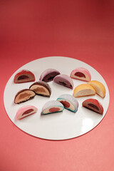 many pieces of cakes with different fillings top view