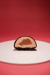 chocolate cake with nut filling on white tray