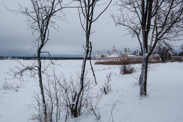 View of the Kirillo-Belozersky Monastery from the lake side through the trees. Vologda Region