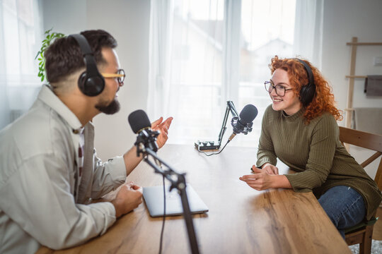 adult man host interviewer woman guest questions while record podcast
