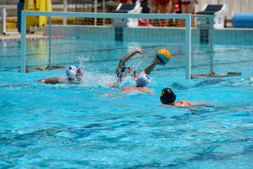 Naklejka premium Athletes in swimming pool. Water polo competition