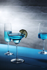 Glasses with blue alcohol cocktail ready for a party	