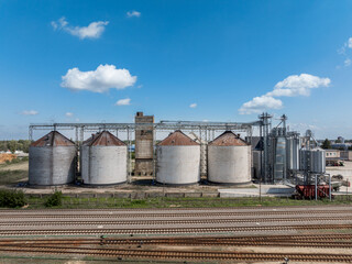 Agro-processing manufacturing plant for processing drying cleaning and storage of agricultural product, grain harvest. Modern silos. grain elevator facility. Large iron terminal of grain