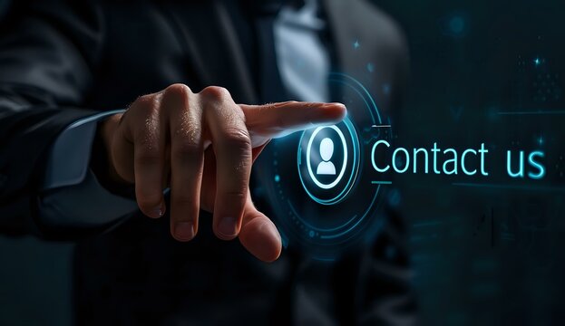 Businessman touching virtual contact us button with glowing user icon, perfect for customer service, support and communication concepts in modern business.