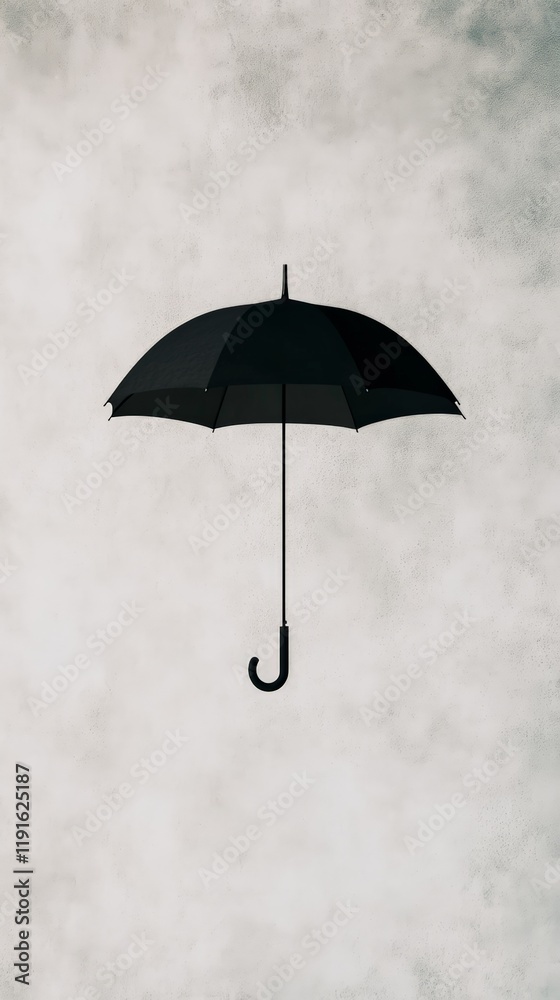 Aufkleber black umbrella floating on a gray background, creating a surreal and minimalist composition with a f