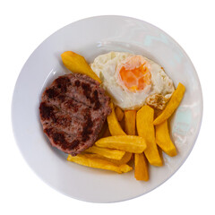 Hearty lunch of potatoes with cutlet and fried eggs. Food is served in large round ceramic plate. Isolated over white background