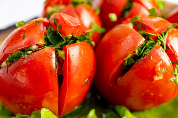 Freshly prepared stuffed tomatoes with herbs and spices ready to serve