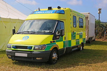 Ambulance parked in a field