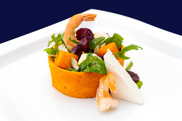 Colorful shrimp salad with fresh greens and creamy cheese served elegantly