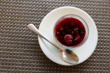 Mascarpone cheese dessert with wild berries and jelly. Sweet dessert of cream cheese and berry jam