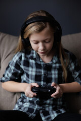 Portrait of girl Playing Game on phone. Relaxing in Living Room