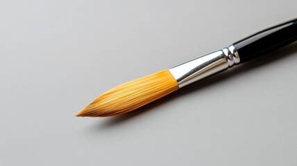 Fototapeta premium Close-up of painting brush on neutral surface