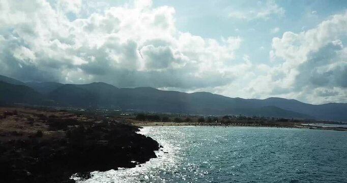 Drone Flight Near Rocks on the Beach Close to Potamos Beach, Near Chersonisos, Crete &ndash; Aerial Views Under the Bright Midday Sun