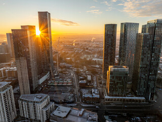 Beautiful sunrise over Deansgate Square high-rises in Manchester UK with cityscape covered with...