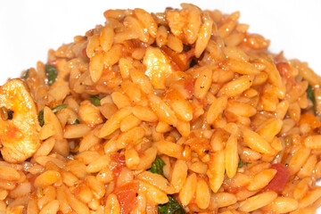 Close Up of Tomoto Based Orzo Rice Sauce Dinner Snack Dish on a White Background
