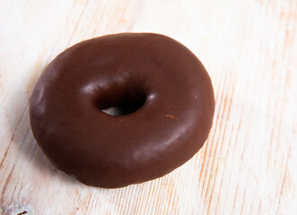 Appetizing chocolate-coated donut closeup. High quality photo