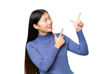 Young Asian woman over isolated chroma key background pointing with the index finger a great idea