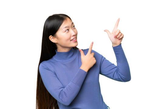 Young Asian woman over isolated chroma key background pointing with the index finger a great idea