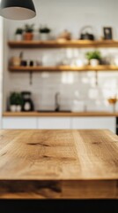 Empty wooden table presenting modern kitchen interior with shelves, plants, and kitchen appliances in the background, creating a warm and inviting atmosphere