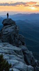Fototapeta premium A lone hiker standing on a rocky outcrop overlooking a vast mountain range at sunset