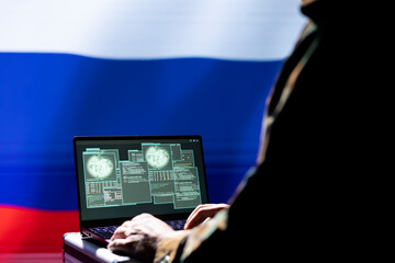 Russian soldier using military tech on laptop to identify threats from enemies. Russia ex KGB FSB...