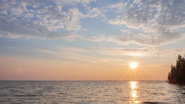 panoramic view of sun radius glowing in the soft blue sky.  sun and sustainable energy concept. heavenly atmosphere. Cloudscape nature background b roll footage 4k. 