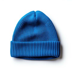 A blue knit hat is sitting on a white background