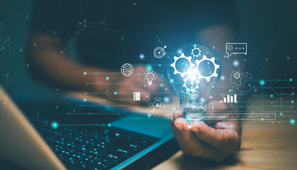 Futuristic innovative technology for business concept. Businessman using laptop and holding lightbulb with AI and icon of financial technology. Generate solution for business by ai assistance.