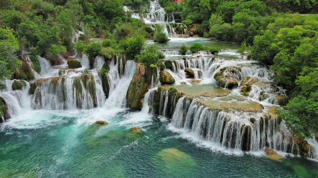 Aerial view of beautiful Krka Waterfalls in Krka National Park, green foliage and turquoise water, Croatia, 4k
