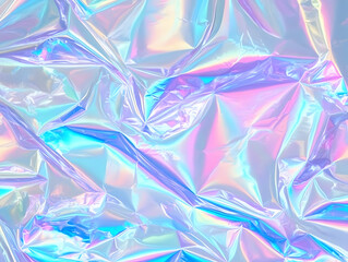 Iridescent holographic wrinkled foil reflects light beautifully and creates a vibrant abstract background.