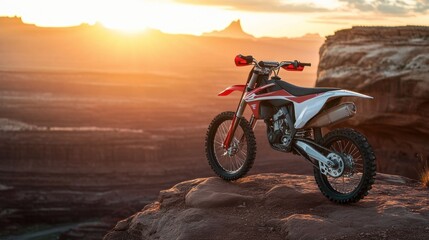 Fototapeta premium Sunset Motocross Adventure: Red Dirt Bike on a Majestic Canyon Rim