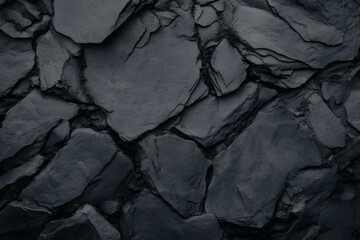 Dark slate stone wall texture creates a dramatic and textured background with rugged, natural beauty.