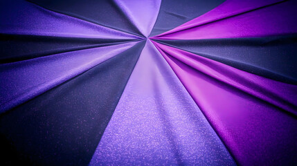 Purple and blue fabric folds create a radial pattern and elegant background texture.