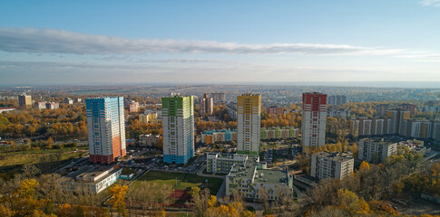 Obraz premium City skyline with colorful buildings and a green park