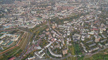 City view from above with many buildings and a road