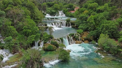 Aerial view of beautiful Krka Waterfalls in Krka National Park, green foliage and turquoise water, Croatia, 4k
