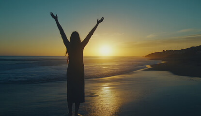 Fototapeta premium Silhouette of Woman Celebrating at Sunset by the Ocean